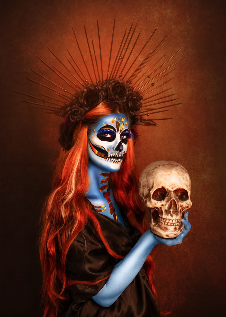 red haired girl holding skull